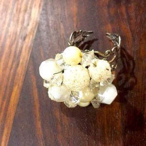 Vintage earring repurposed into a ring